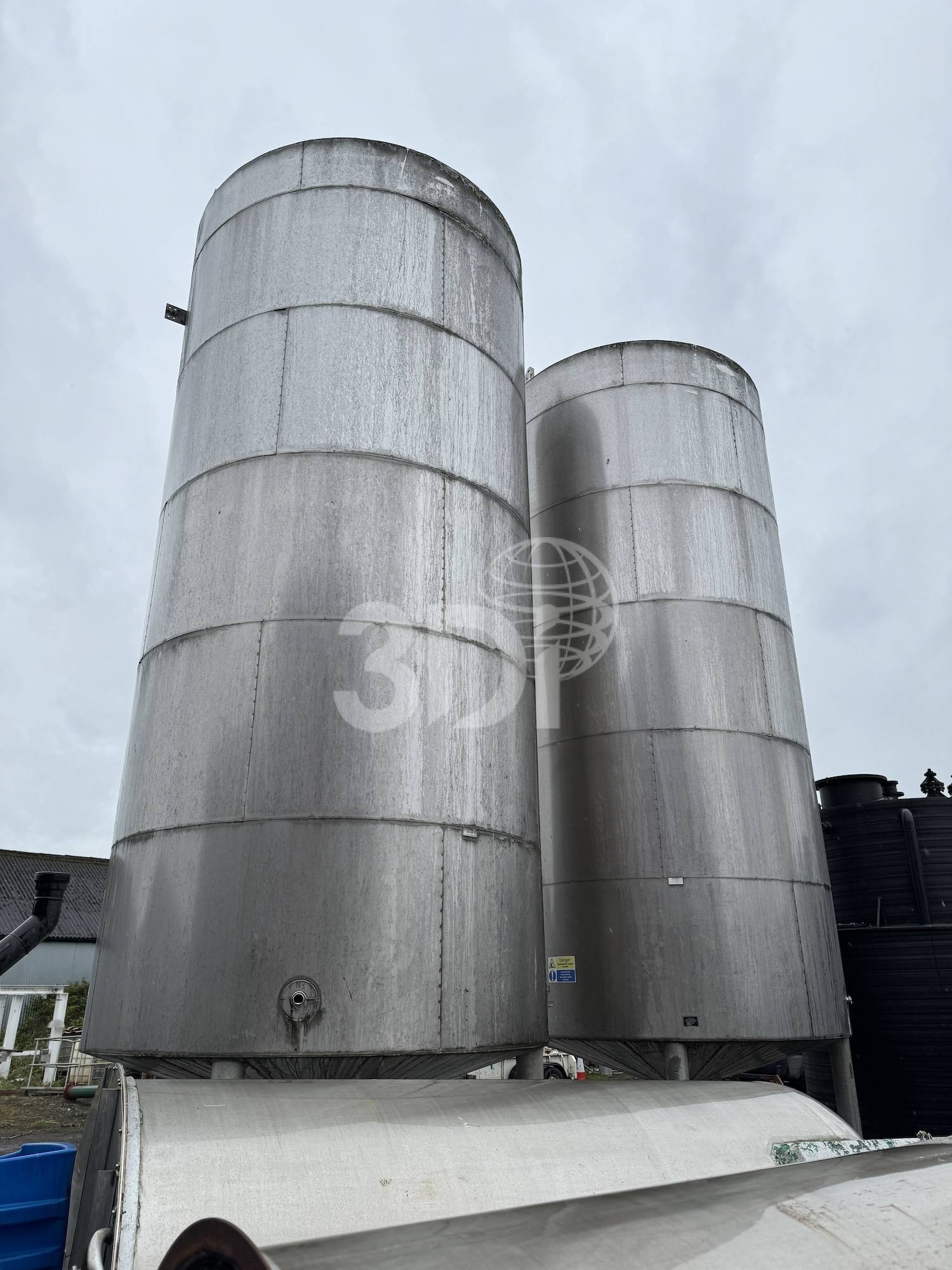 rear image of two 38500 litre jacketed stainless storage tanks