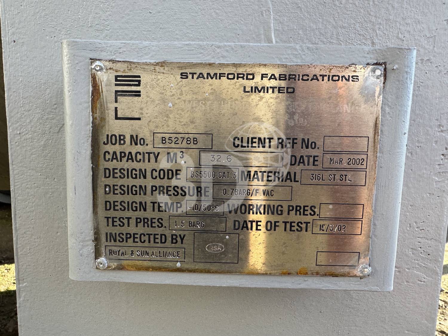 photo of the manufacturers nameplate of a 32600 litre stainless steel storage tank